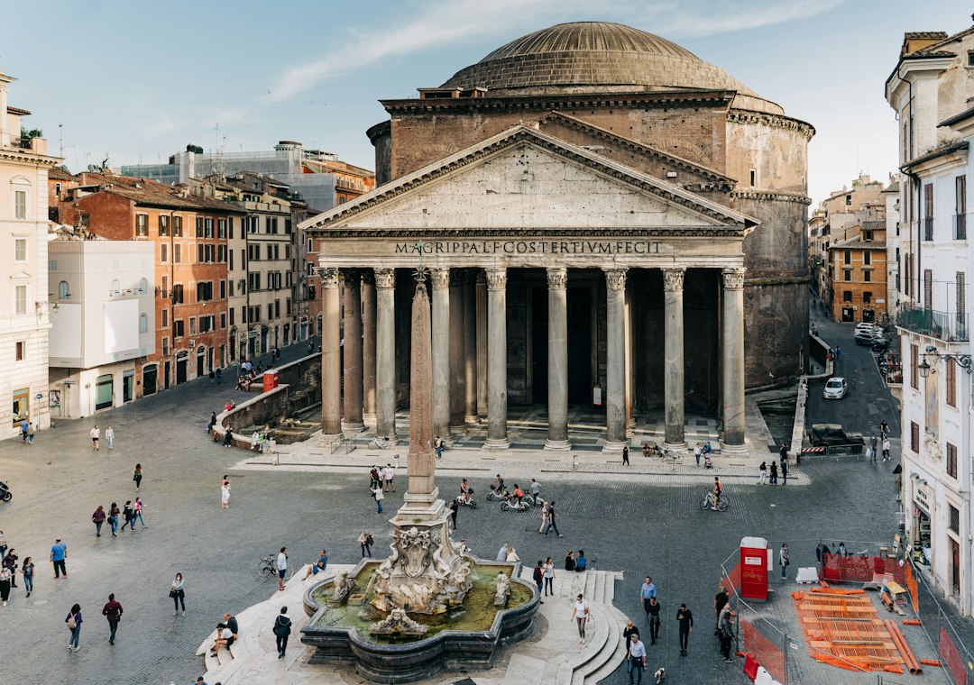 The Pantheon portico in Rome, its columns and inscription above the piazza