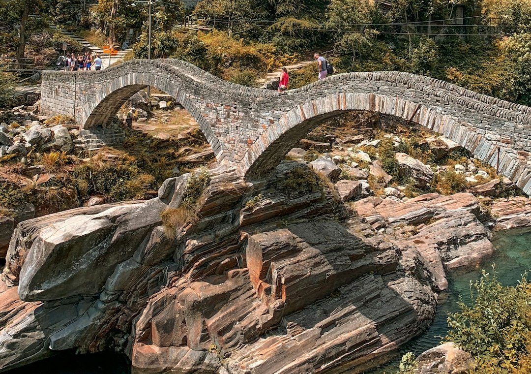 The double stone arch of the Ponte dei Salti over the Verzasca river in Ticino
